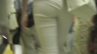 White semi-transparent pants on tight ass